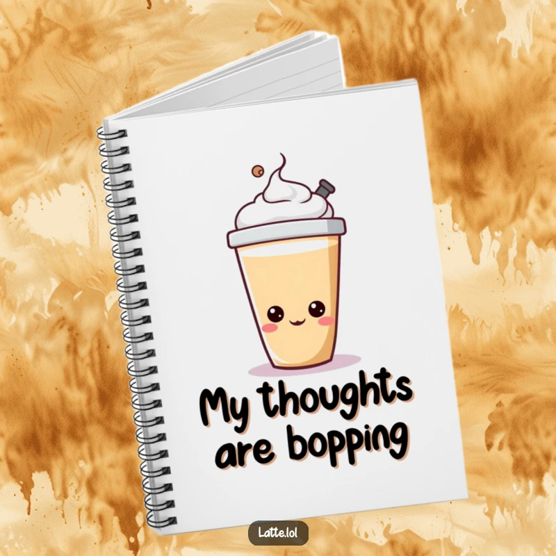 Funny latte cup notebook with a cheerful character happily bopping its lid, inspiring creativity.
